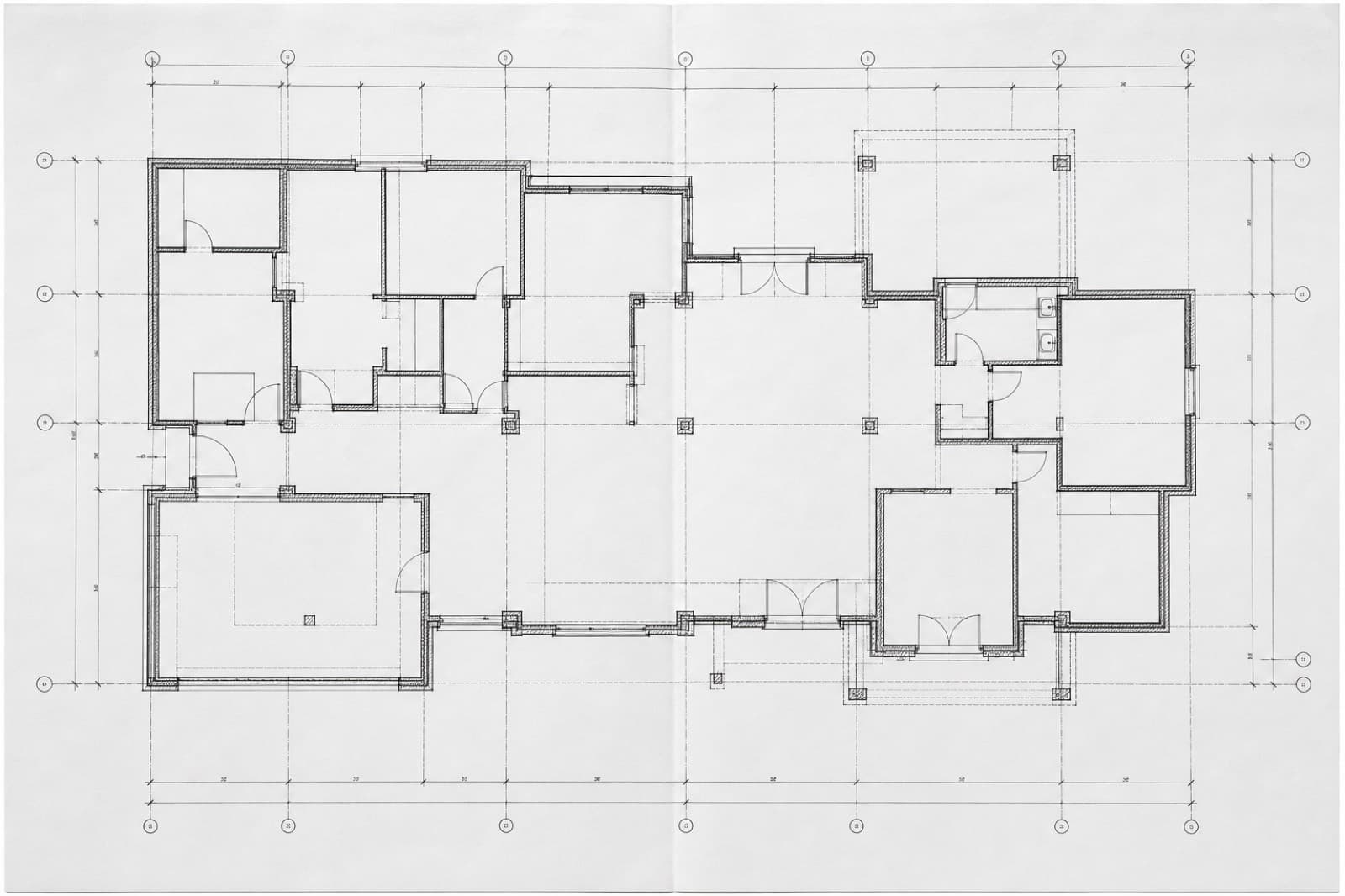 Architectural floor plan spread on a drafting table.